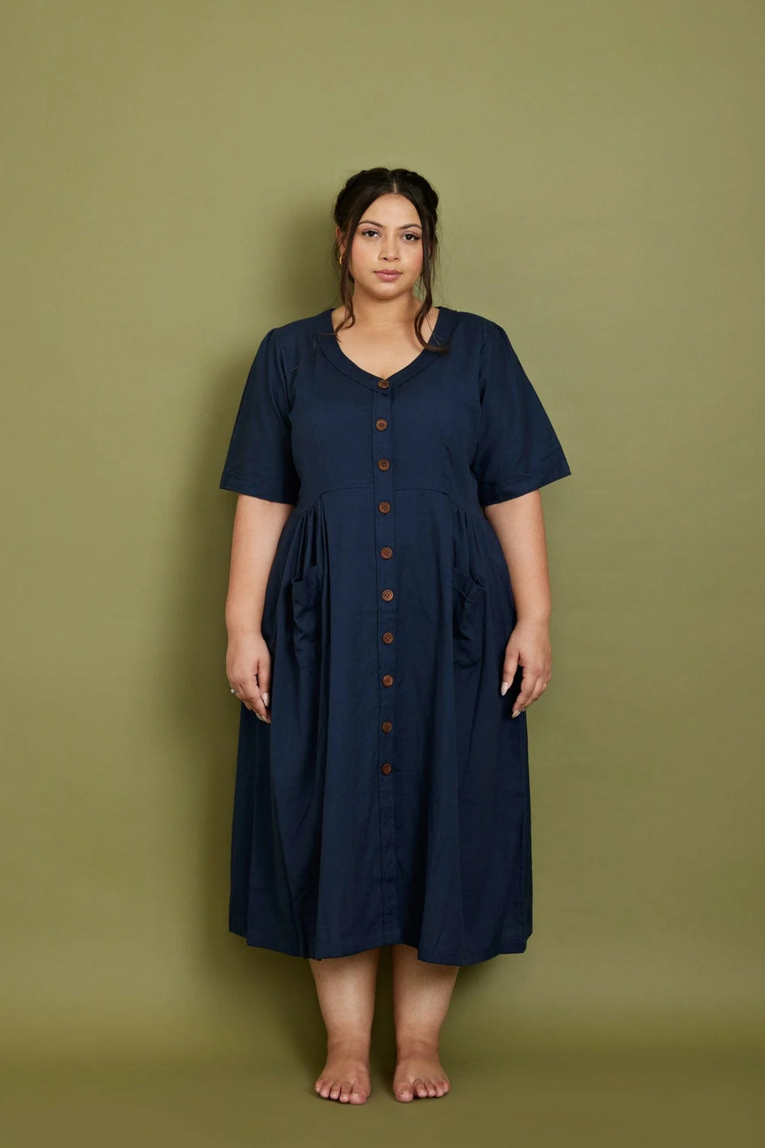 plus size woman wearing navy midi dress