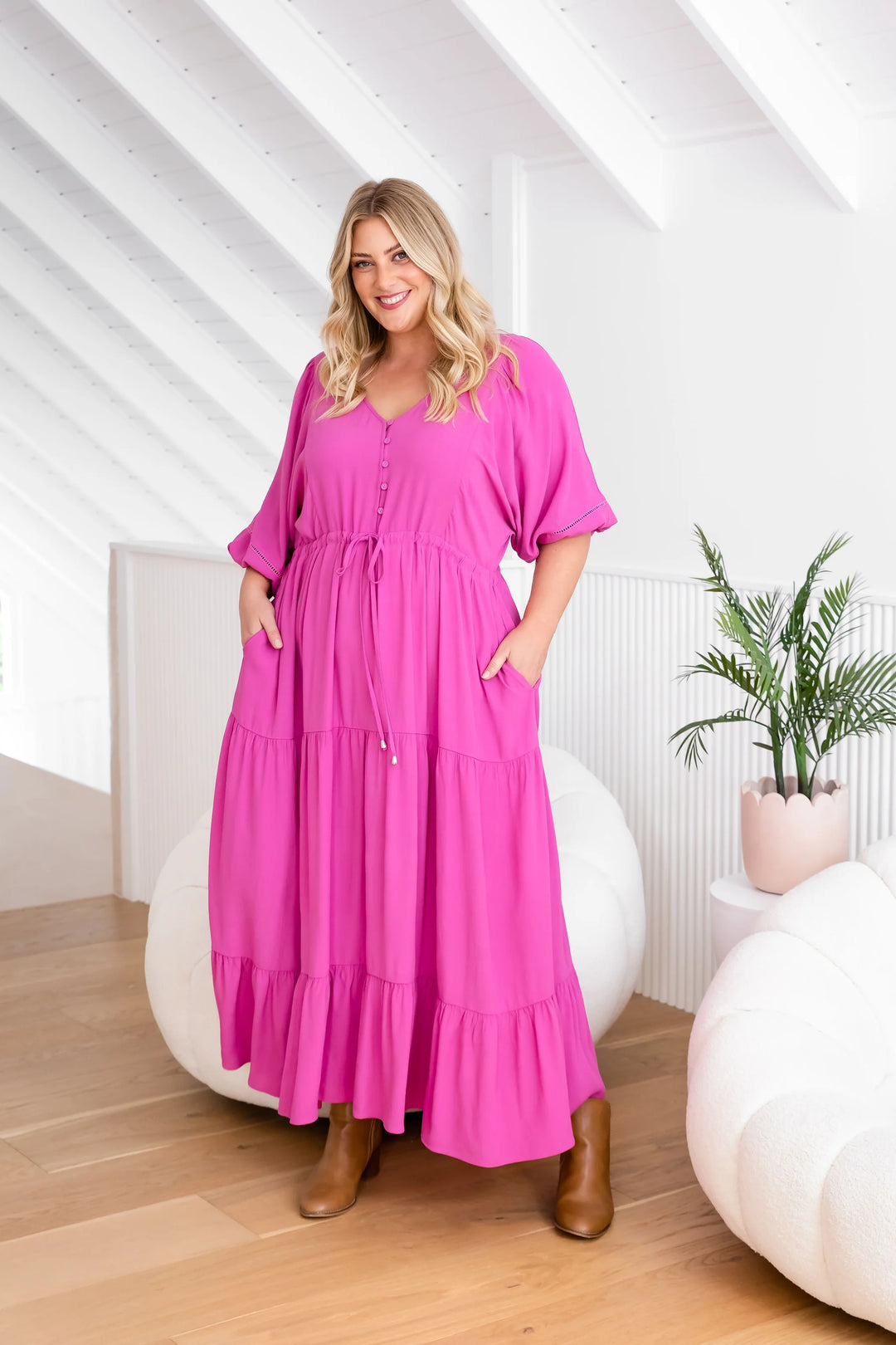 plus size woman wearing pink maxi dress