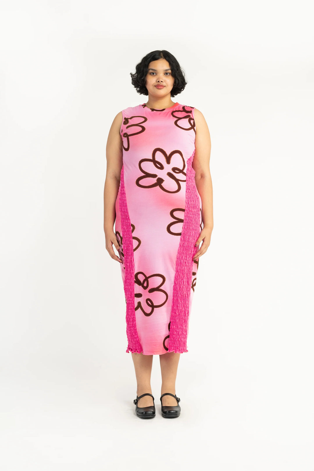 plus size woman wearing body con pink flower print dress
