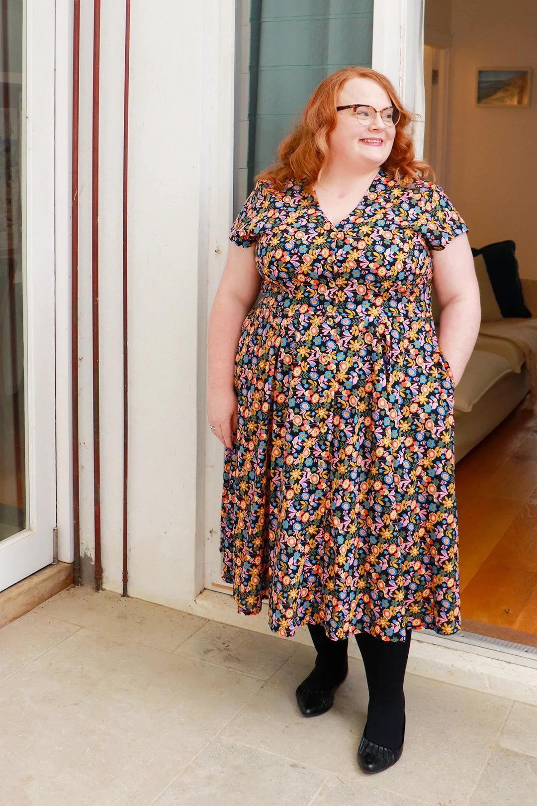plus size woman wearing midi flower print dress