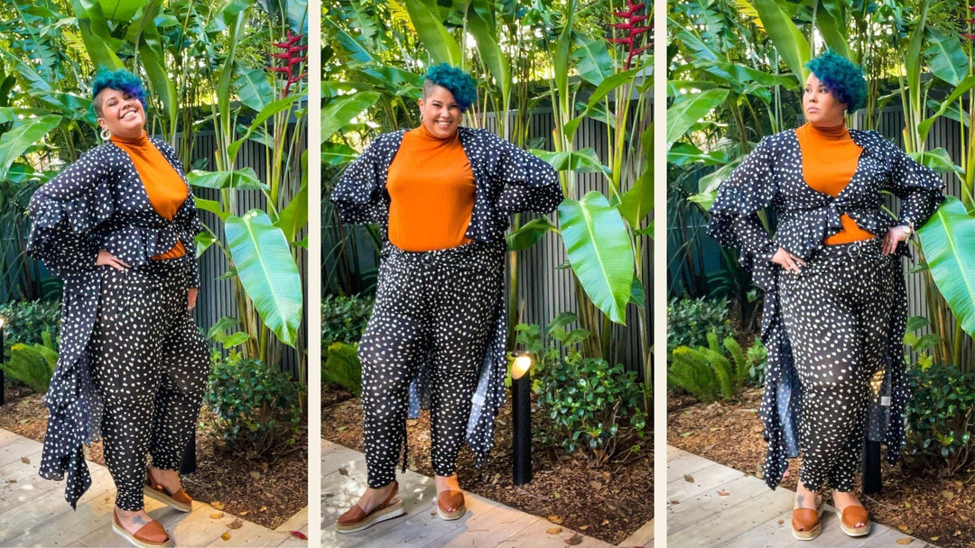 Fat Activist The Bodzilla wearing plus size fashion from LeukBook. April is wearing an orange turtle neck from size inclusive Australian fashion designer Pablo and Kat. April is wearing a matching navy blue confetti print pants and long sleeve cover up.