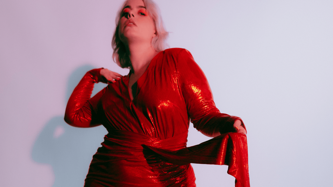 Plus size model wearing red metallic dress by size inclusive Australian designer Novella the Label available on LeukBook with free shipping and returns