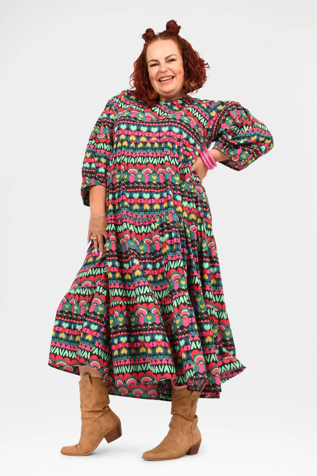 woman wearing colourful print midi dress with boots