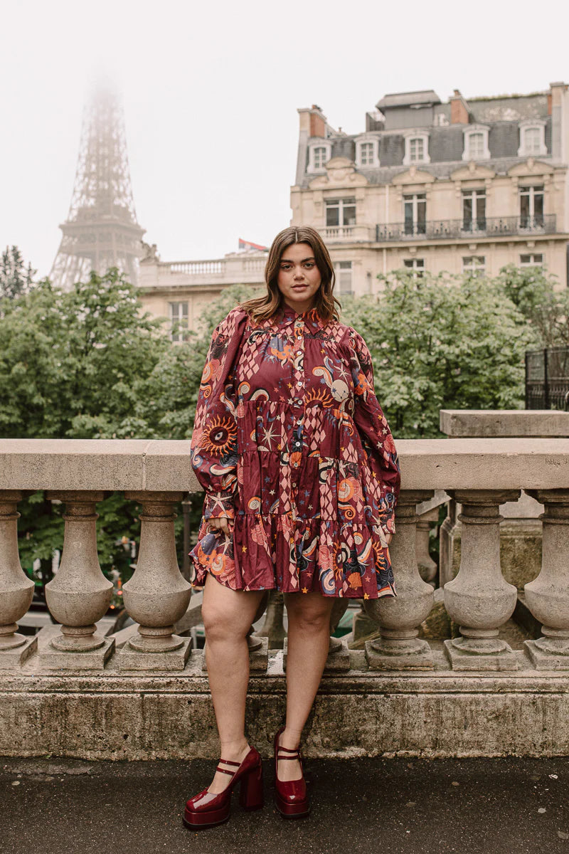 plus size woman wearing long sleeve red mini dress