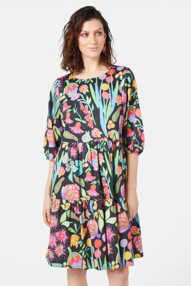 woman wearing mini floral dress with 3/4 sleeves