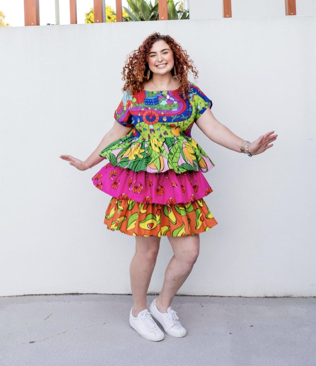 plus size woman wearing mini dress with raffle designed skirt